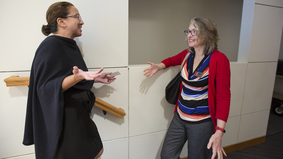 Rona Halualani (left) talks with June Griffin, associate dean for undergraduate education in the College of Arts and Sciences, after the second open forum on Sept. 25.