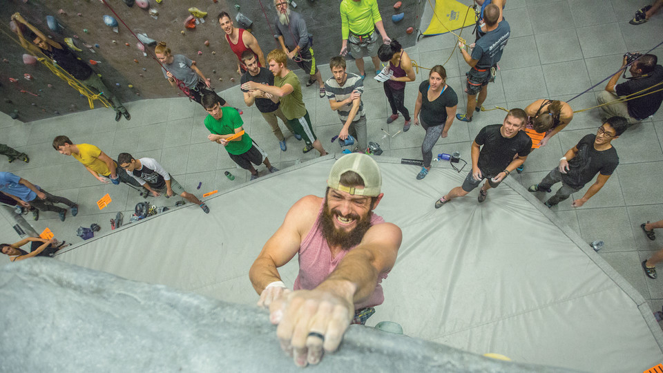 Brad South reaches the top of a climbing path during Campus Recreation's League of Extraordinary Boulderers contest on Nov. 1 at the Outdoor Adventures Center. The league continues through Nov. 15. It is open to the public.