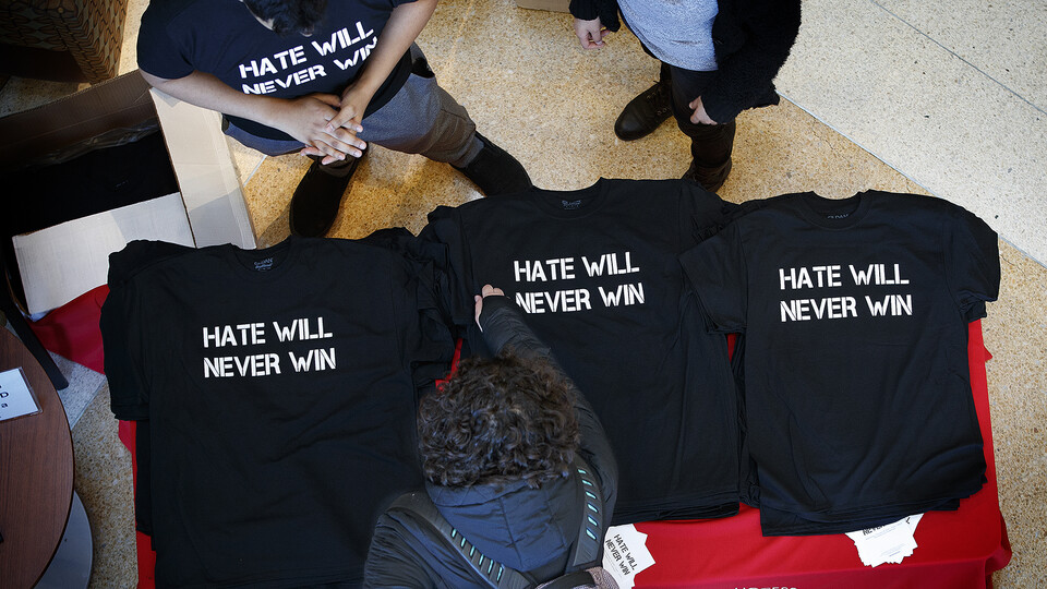Nebraska students hand out “Hate Will Never Win” T-shirts in the Jackie Gaughan Multicultural Center before a campus rally in February 2018.