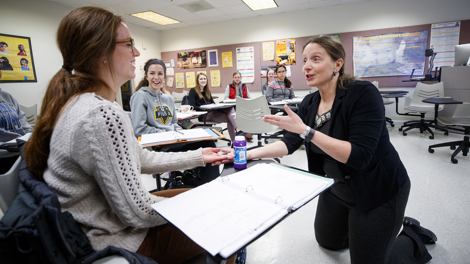 Cynthia Cress, associate professor of special education and communication disorders, uses bubbles to teach students how to communicate with children in a language disorders in special populations course.