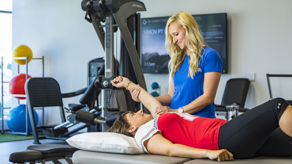 Jenny Meints, a licensed physical therapist assistant, works with a volunteer in the University Health Center's new physical therapy space. The facility includes a warm-water therapy pool, gym and private patient rooms.
