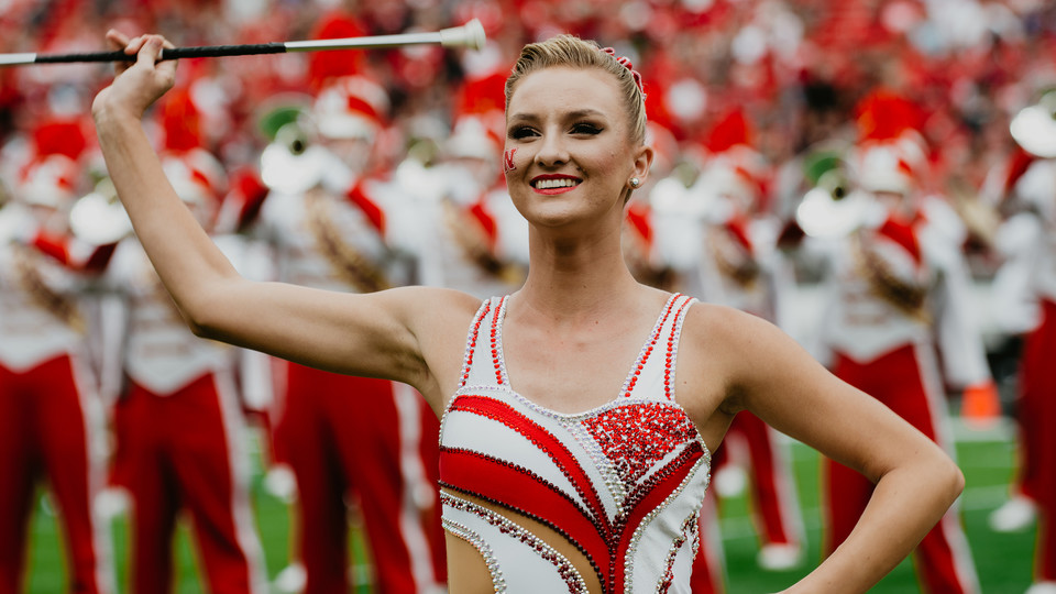 Kimberly Law, a freshman chemical engineering major from La Quinta, California, is one of two featured twirlers in the Cornhusker Marching Band.