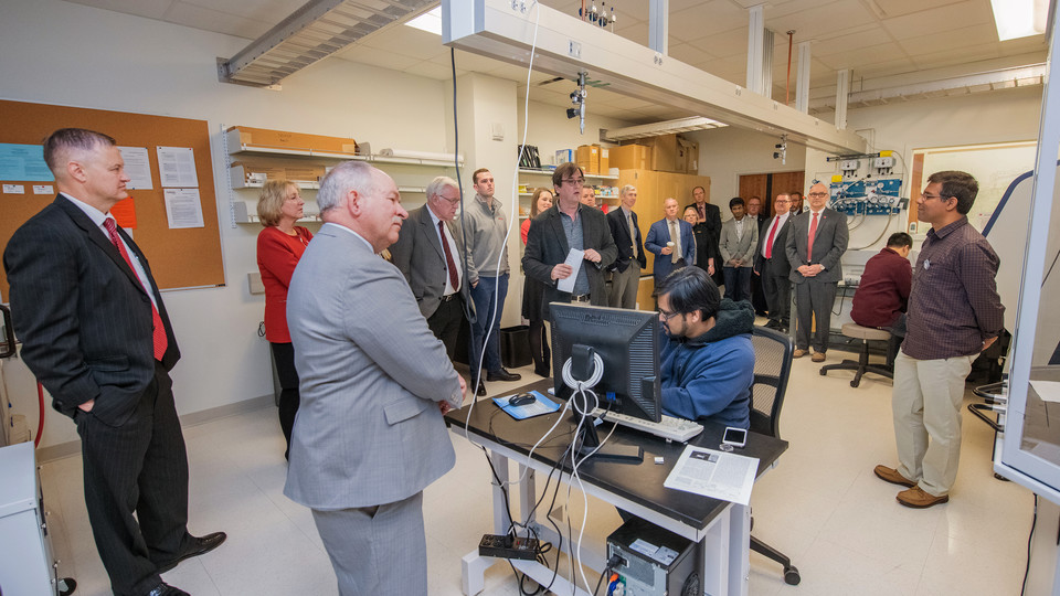 Nebraska's Christian Binek (center) leads the NU Regents and other university officials in a tour of research space in the Voelte-Keegan Nanoscience Research Center on Jan. 24. The regents toured a variety of campus facilities as part of an annual visit.