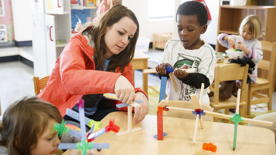 Nebraska alumna Monica Meyer works with children at the Malone Center in February 2019. Meyer is a graduate of the award-winning Child, Youth and Family Studies program.