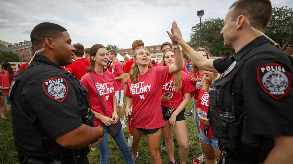 University Police officers interact directly with students during the chancellor's barbecue at the start of the 2019 fall semester. The department has recently made changes that focus on community engagement.