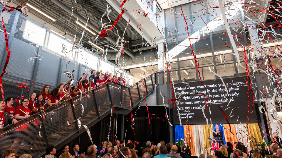 Carson Center students launch confetti from the stairs of the new facility during the Nov. 16 grand opening celebration.