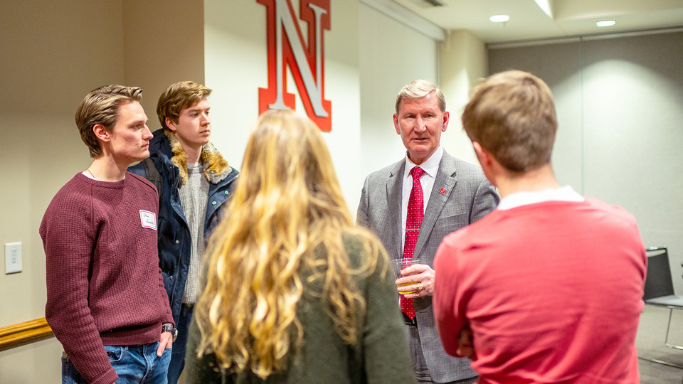 Ted Carter talks with students during a dinner on Jan. 16. The event featured leaders from recognized student organizations, including the Association of Students of the University of Nebraska.