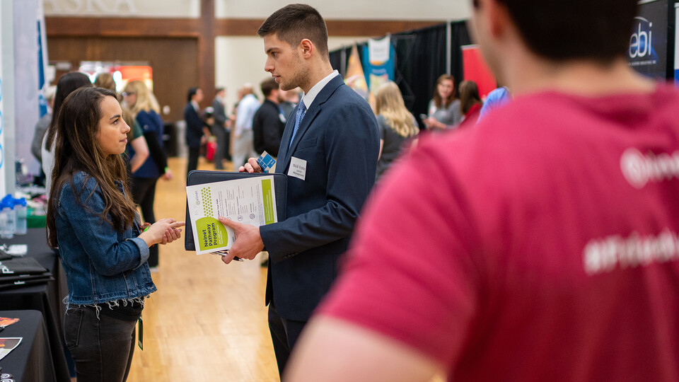 Nick Vetter, a junior management major, meets with a Nelnet recruiter during the 2020 Spring Career Fair. The fair included 160 companies from across the country looking to connect Nebraska students with both job and internship opportunities.