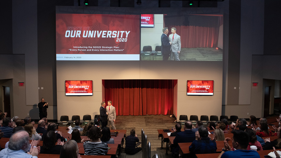 Chancellor Ronnie Green is greeted by Ted Carter, president of the University of Nebraska system at the start of the Feb. 14 State of Our University address.