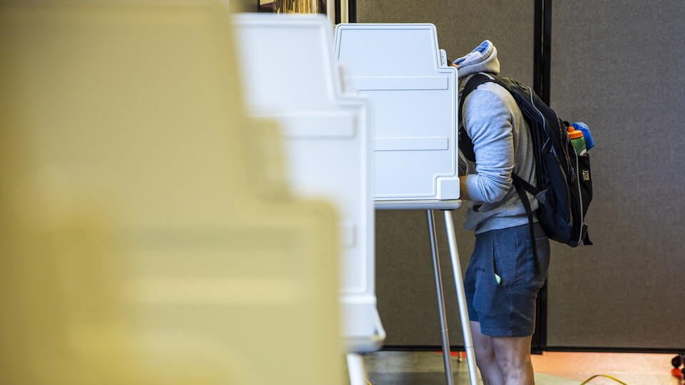 A student casts a ballot in Nebraska Union during the 2020 general election Nov. 3, 2020.