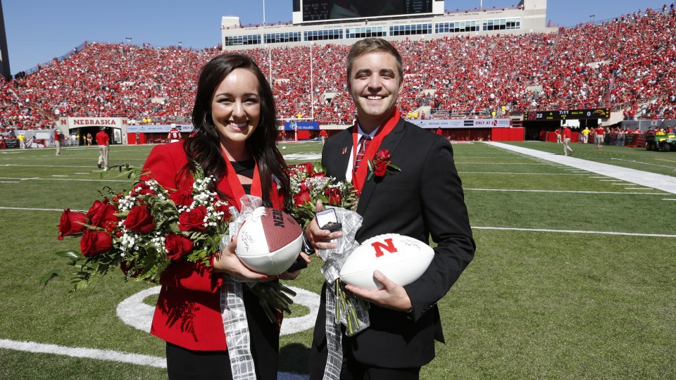 Homecoming queen and king Maggie Schneider and Tommy Olson appear at halftime of the Nebraska-Southern Miss game.
