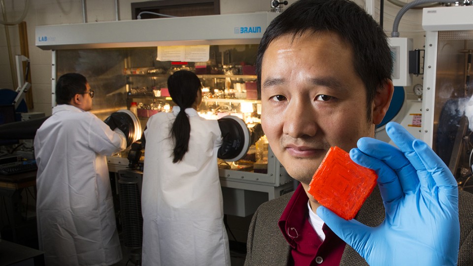 UNL engineer Jinsong Huang holds a crystal that can detect significantly smaller doses of X-rays than materials used in leading commercial detectors, as reported in a new study published by the journal Nature Photonics.
