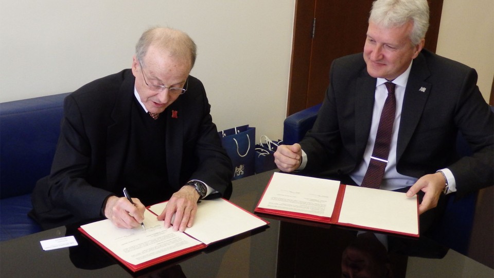 UNL Chancellor Harvey Perlman (left) and Czech Technical University Rector Petr Konvalinka sign a memorandum of understanding between the two universities March 21 in Prague.