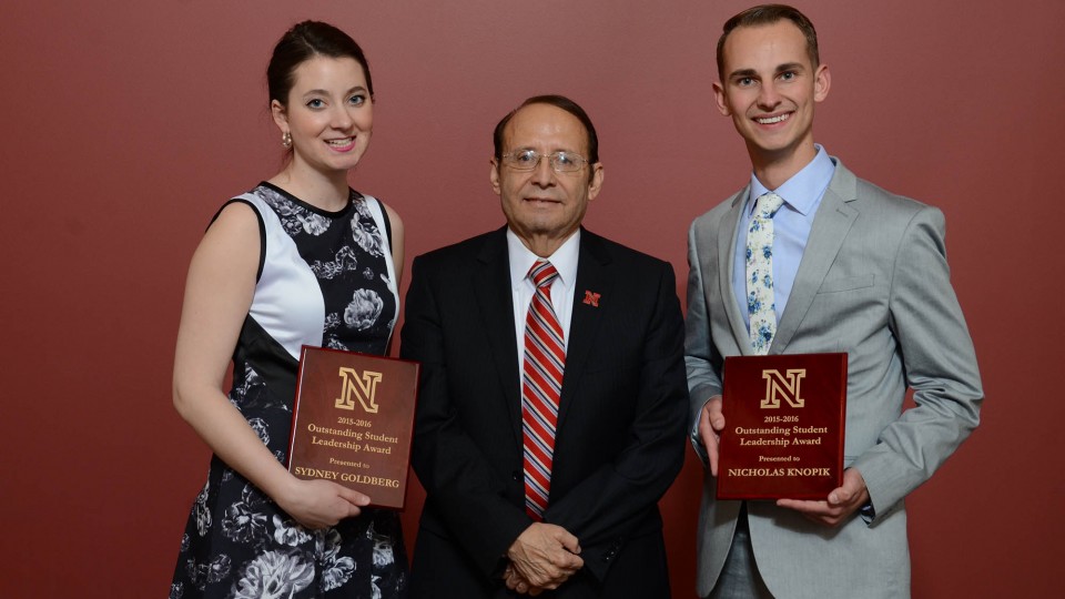 Outstanding Student Leadership Award winners Sydney Goldberg and Nicholas Knopik stand with Juan Franco, vice chancellor for students affairs, during a ceremony April 22.