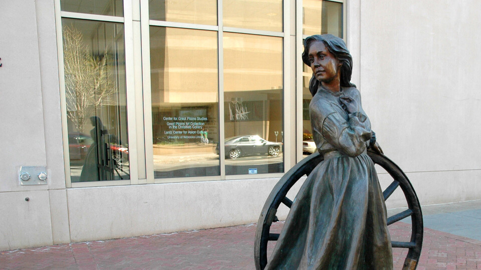 Statue of prairie woman outside Center for Great Plains Studies