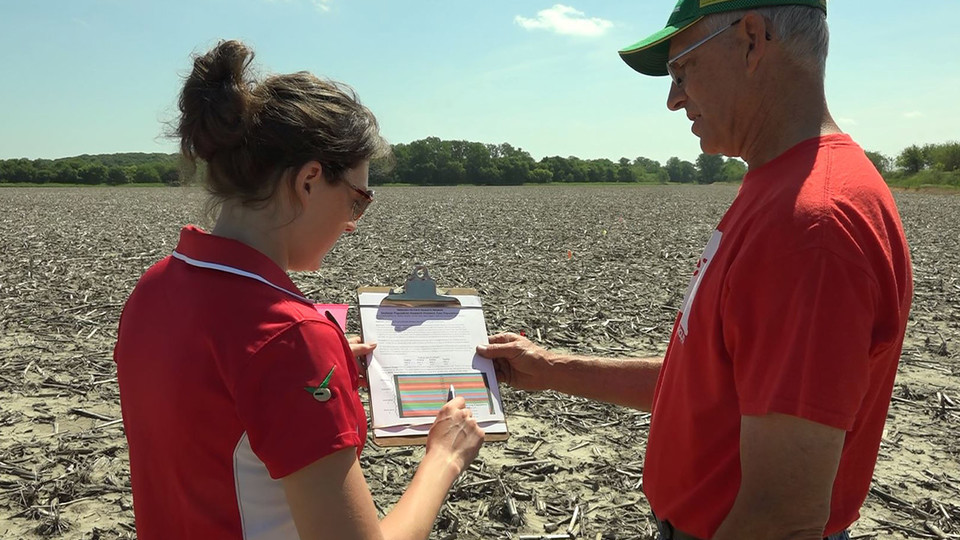 Laura Thompson discusses an on-farm research plan with a grower. A new tool is available on the Nebraska On-Farm Research Network website that allows growers to find out about research projects conducted on farms in their area.
