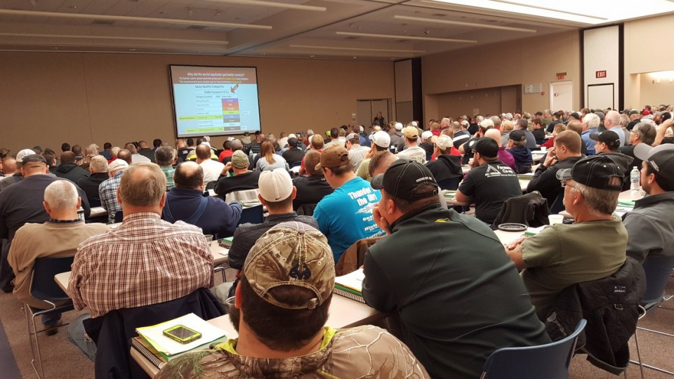 Agriculture producers listen to a research-based presentation during a Nebraska Extension crop production clinic in Norfolk in January.