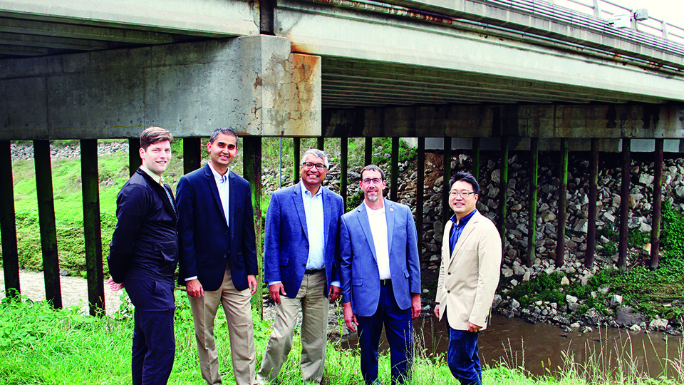 Project researchers, standing in front of a bridge in the study, are (from left) Brian Ricks, Robin Gandhi, Deepak Khazanchi, Daniel Linzell and Chungwook Sim.