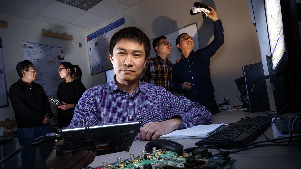 Sheng Wei (center), assistant professor of engineering and computer science at Nebraska, has earned a Faculty Early Career Development Program award from the National Science Foundation to advance his work in computer hardware security and trust. Behind Wei is (from left) visiting scholar Yong Tang and doctoral students Mengmei Ye, Xianglong Feng and Nan Jiang.