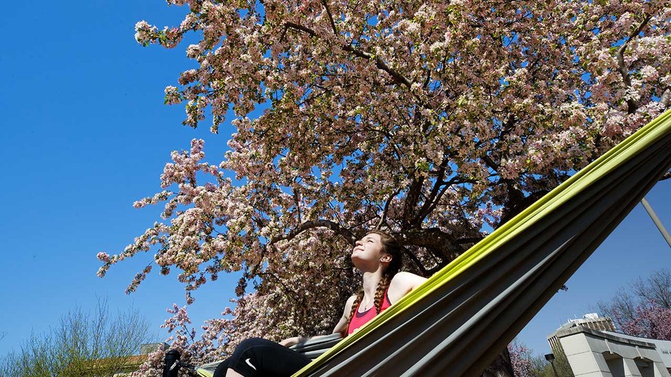 Kelsey Ewert of Ogallala enjoys the sunshine May 4 as she sits in a hammock outside the Nebraska Union. Ewert and more than 4,800 other University of Nebraska–Lincoln students made the spring Deans' List/Explore Center List of Distinguished Students.