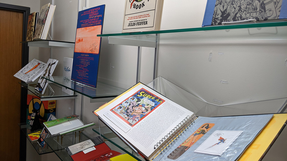 The exhibition “Reading Comics: Select Books from the Dan Howard Collection” runs through the spring semester in the lower level of Love Library South.