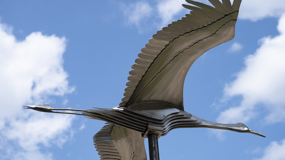Stainless steel crane sculpture