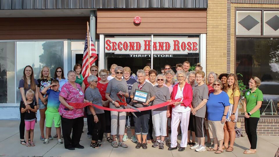 Kaylee Burnside and Clare Umutoni, Rural Fellows working with the Ord Area Chamber of Commerce, attend Second Hand Rose’s ribbon-cutting to celebrate its new storefront.