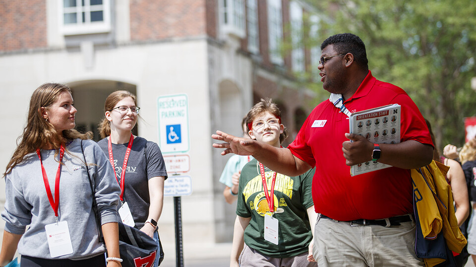 Orientation leader Jayven Brandt shares his experiences as a Husker with incoming freshmen outside the Nebraska Union in June 2021. Orientation leaders help welcome more than 4,500 students and their family members to campus during the Office of New Student Enrollment’s flagship summer program.