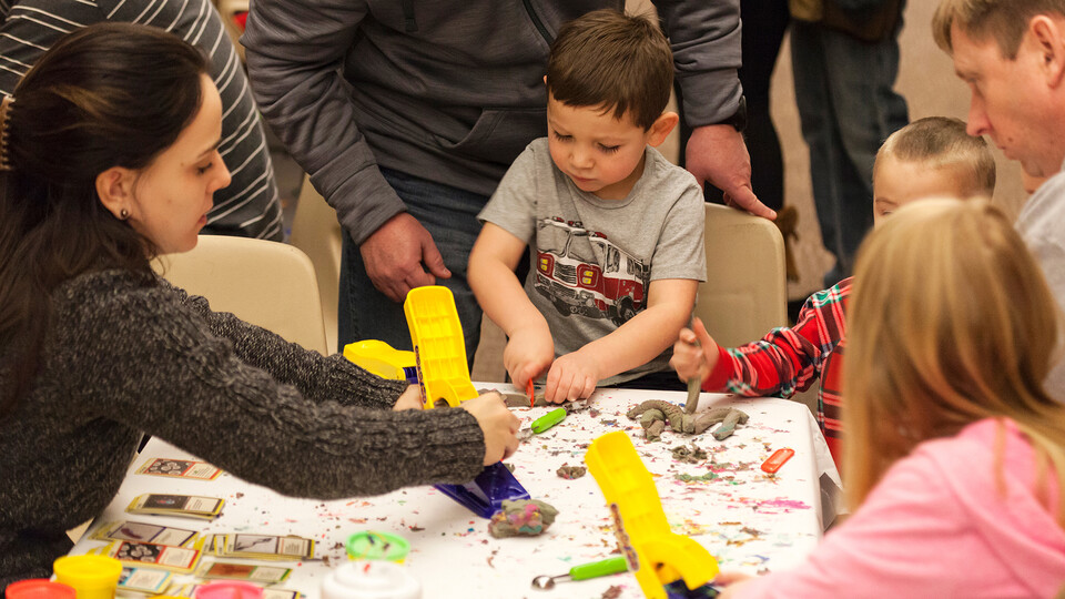 Children work with modeling clay during a previous Dinosaurs and Disasters event at Morrill Hall. The 2023 event is 9 a.m. to 5 p.m. Feb. 4. (NU State Museum)