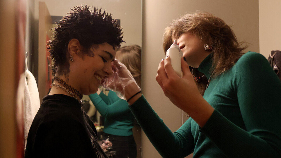 From Amber Rodriguez’s essay “Beyond the Binary”: Mari Pilling, 21, with fresh black dyed hair, applies black eyeliner to their bottom eyelids for an evening makeup look in their apartment bathroom Feb. 25 in Lincoln. Pilling loves to express their genderless identity through unisex clothing, dark shades of makeup, tattoos and piercings. “I want the art that has brought me up to this point to be represented with who I am on my skin,” Pilling said. “I definitely believe that you wear your heart on your sleeve, and I'm literally putting that at practice and making sure that my story is literally left on my body.”