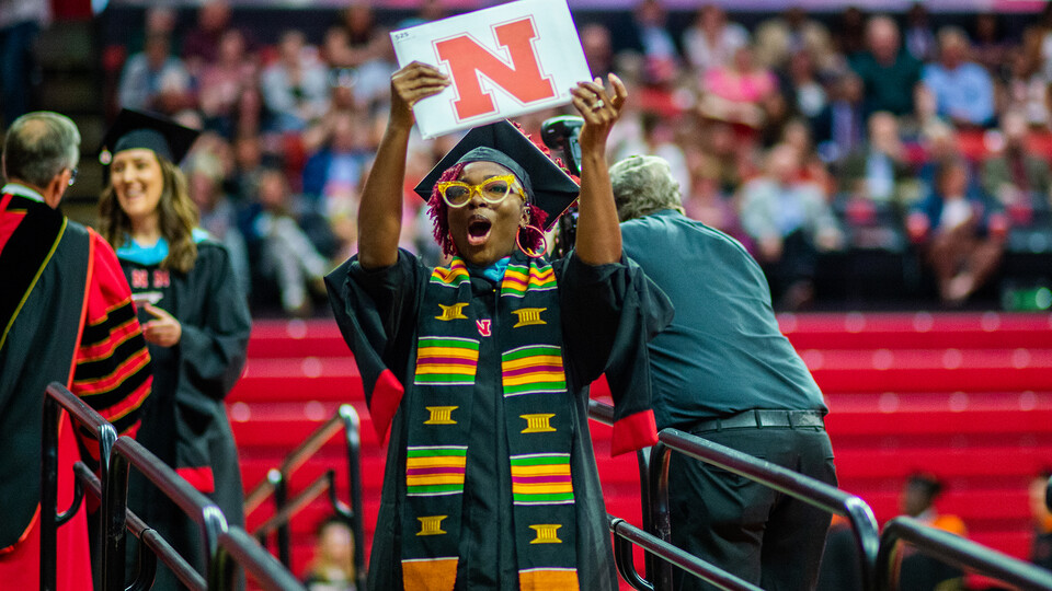 Ja'Lesa Reed celebrates after receiving her Master of Education during the graduate and professional degree ceremony May 19 at the Bob Devaney Sports Center.