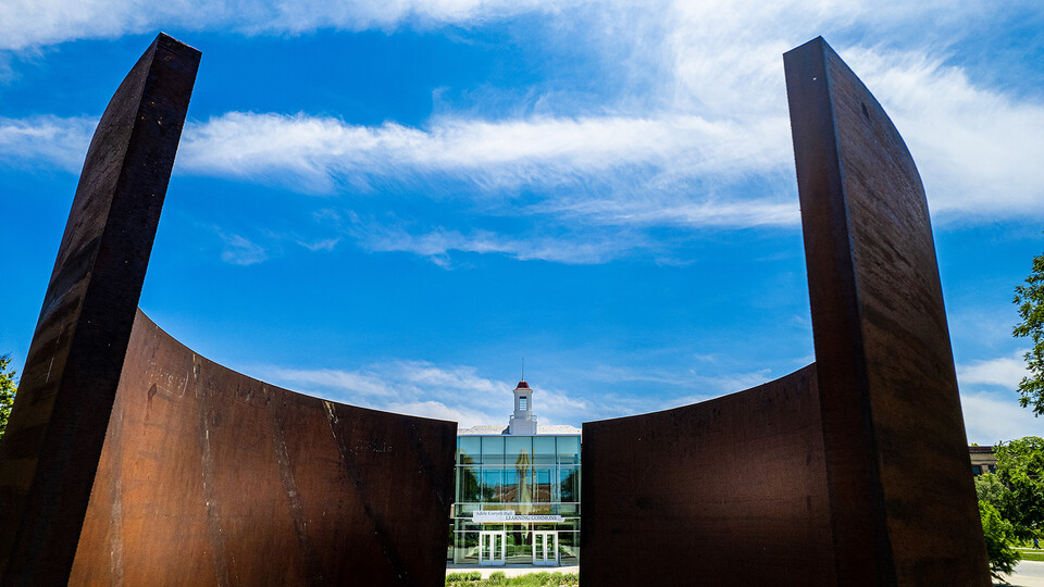 The Greenpoint sculpture frames the north entrance of the Adele Hall Learning Commons on the University of Nebraska-Lincoln campus.