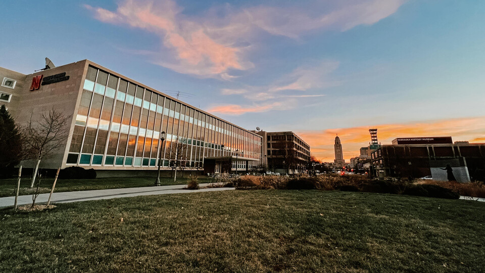 Andersen Hall and Centennial Mall, with Nebraska State Capitol in background, at sunset