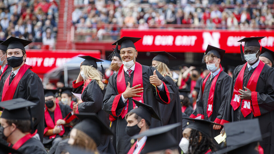 Nebraska's Adrian Martinez stops for a photo during May 2021 commencement exercises in Memorial Stadium. Announced Dec. 2 by the NCAA, Nebraska student-athletes earned a school record 95% graduation success rate.