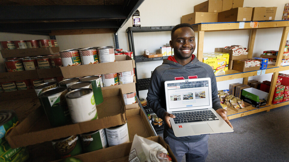 Gabin Kundwa helped the Connection Point food bank keep track of their clients by writing a software program that replaced hand written note cards.