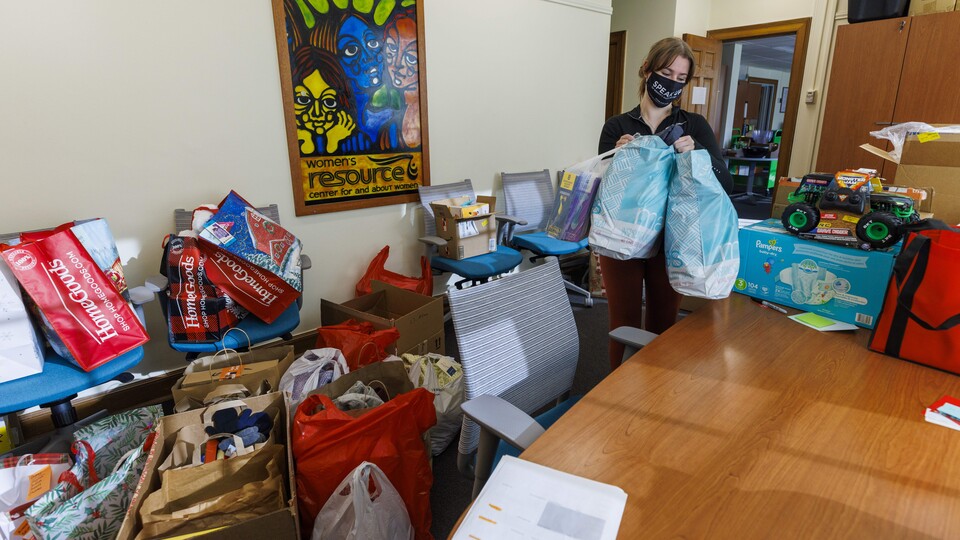 A worker in The Women's Center organizes donations.