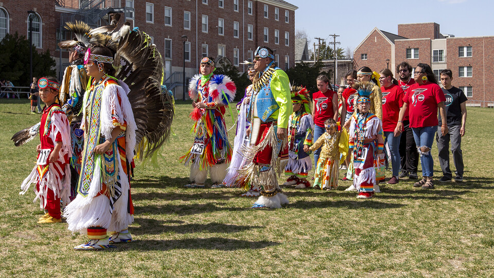 Members of UNITE (at right) dance in the circle during an intertribal portion of the powwow.