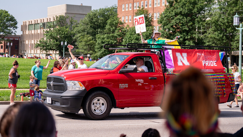 University representatives wave to the crowd during the second annual Star City Pride parade.