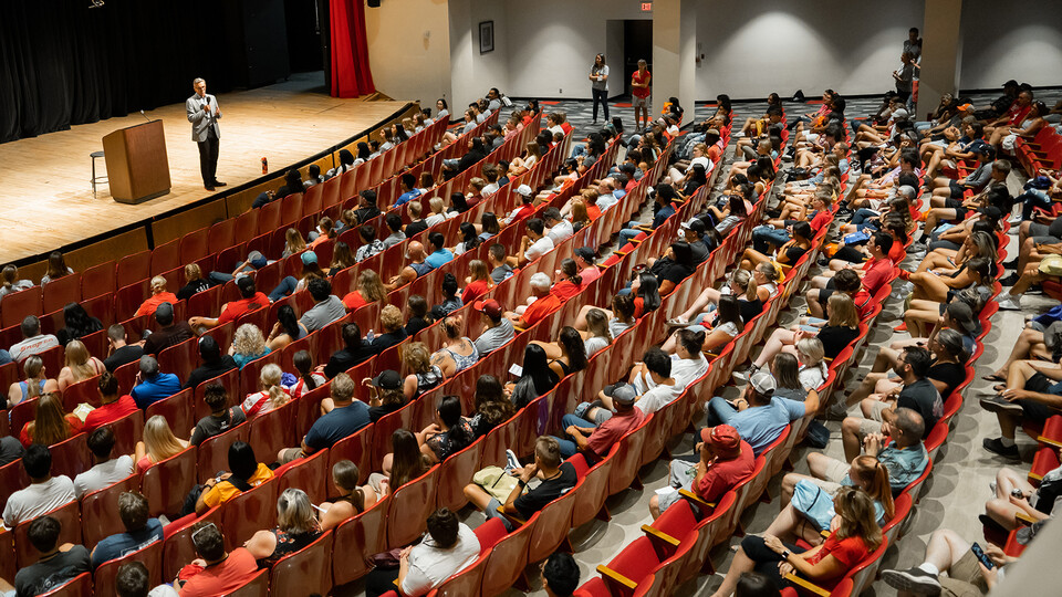 Photo of a large lecture hall with students in seats
