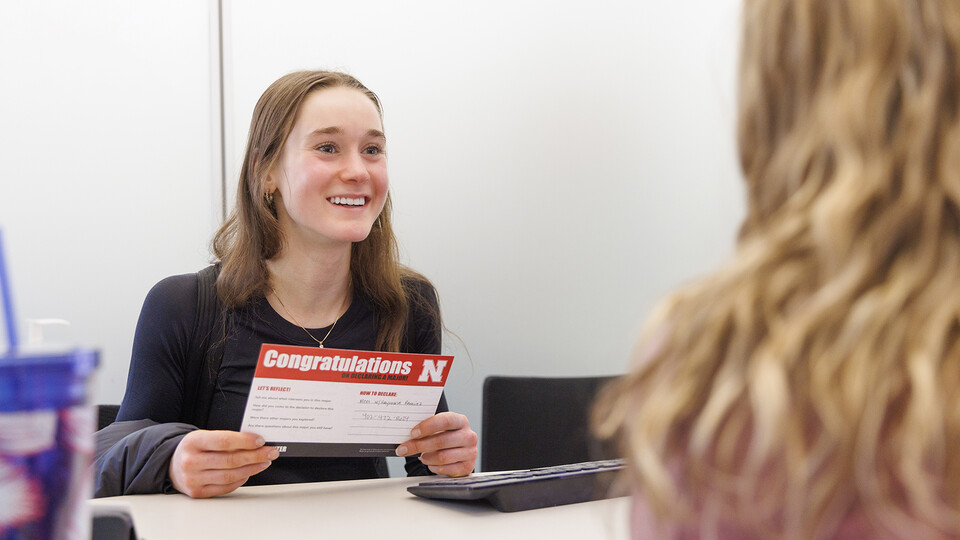 Alexis Dent, a first-year student, beams during a meeting with the Explore Center's Elisa Heide. Dent was all smiles after identifying nutrition, exercise and health sciences as her perfect major. 