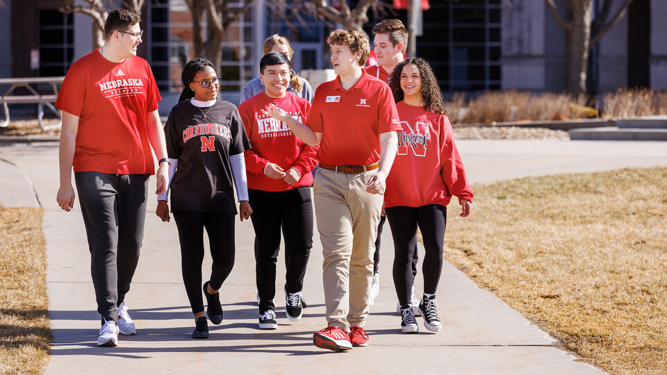 Prospective Huskers utilize a warmer February day to tour campus.