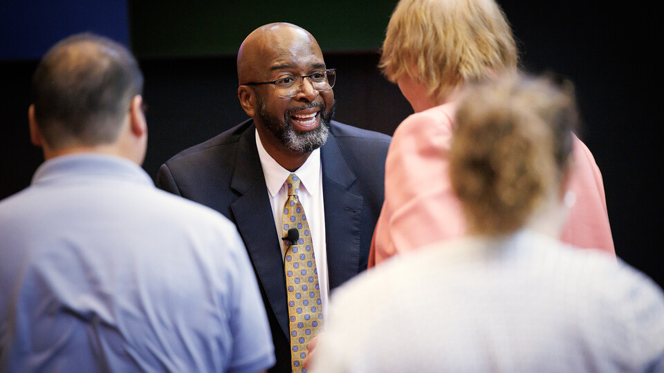 Rodney Bennett smiles as he greets staff and faculty during a public discussion session on June 5. Bennett, the priority candidate to be the university's next chancellor, participated in 17 public forums the week of June 5.