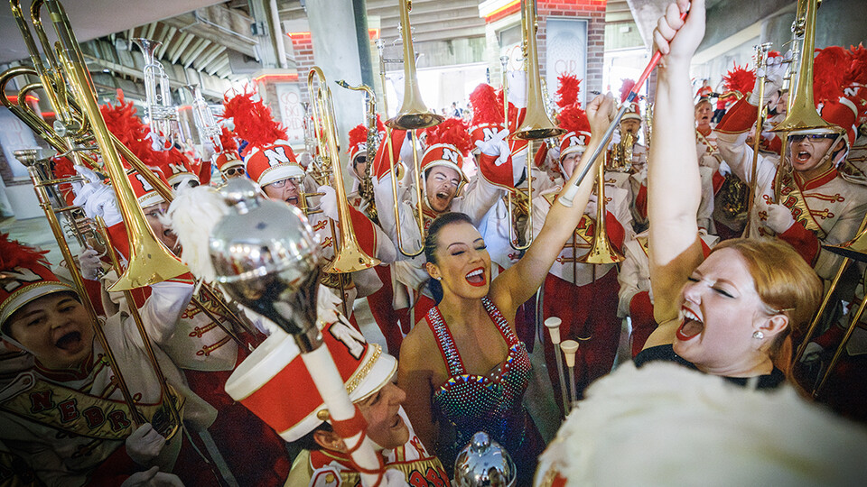 The Cornhusker Marching Band fires up before taking the field after marching to the stadium.