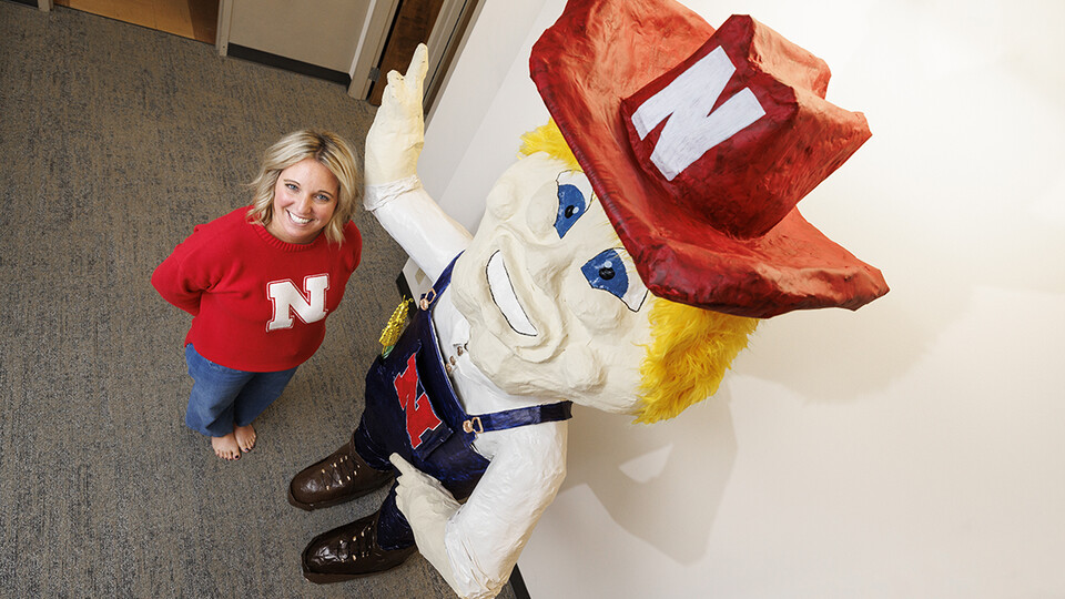 Ashley Dohe, administrative coordinator for Electrical & Computer Engineering, has make an 8-foot tall Herbie Husker from paper mache.  She hopes to auction it off to help veterans.