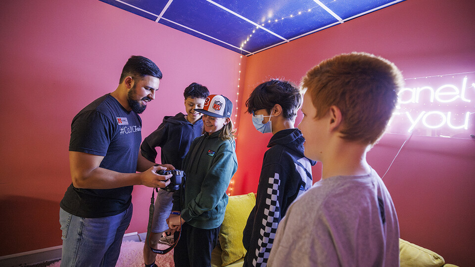 Alex Fernando leads a workshop for students from Lefler Middle School in Lincoln. Fernando and CoJMC ambassadors had the students taking photos, shooting video, social media posts and an advertising campaign.
