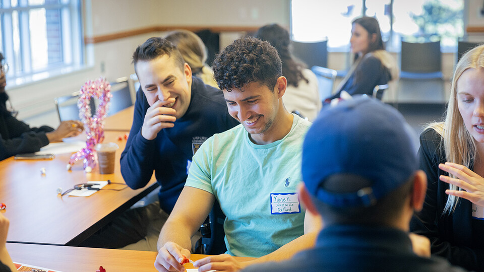 Yamen Seanwan (front) and Jay Mayberger laugh as they compare study abroad experiences.