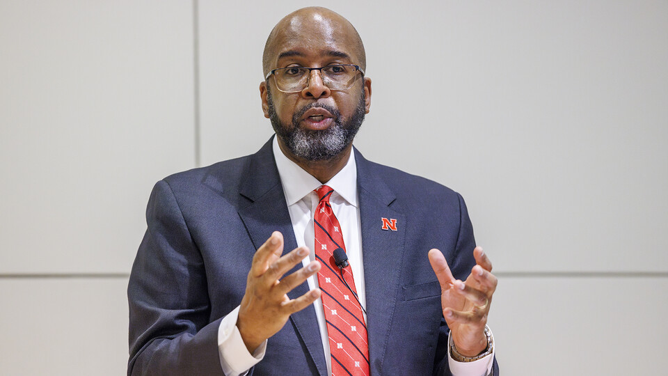 Chancellor Rodney D. Bennett gestures during his Feb. 15 Charter Day address to university leaders. The presentation was held in the Nebraska Union's Swanson Auditorium.