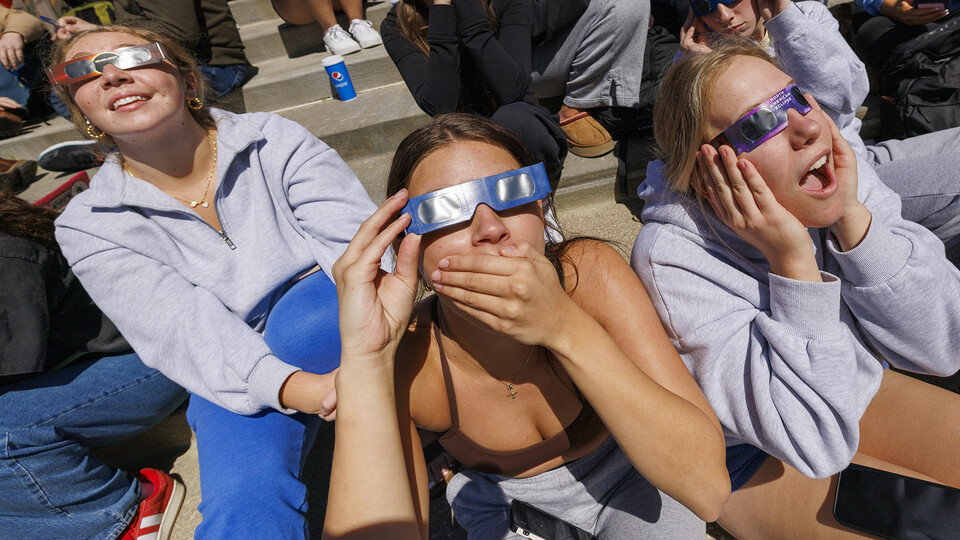 Emma Jonas and Annie Masek react with the other Kappa Kappa Gamma members during the solar eclipse on April 8.