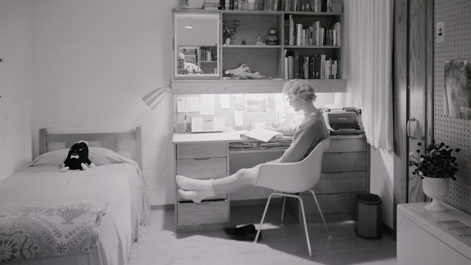 A student sits at a Cather-Pound desk in this photo taken shortly after the residence hall complex opened in 1963. The halls will be razed on Dec. 22.