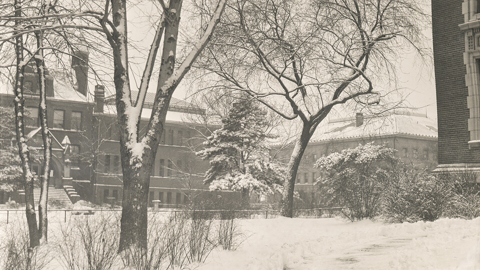 Snow falls on Architecture Hall (then the library) in a historic photo from 1924.